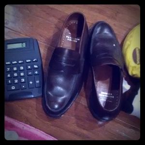 Air Jordans, t-shirt, black and brown loafers,